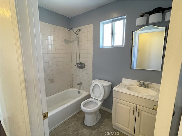 full bathroom with tiled shower / bath combo, toilet, tile patterned flooring, and vanity