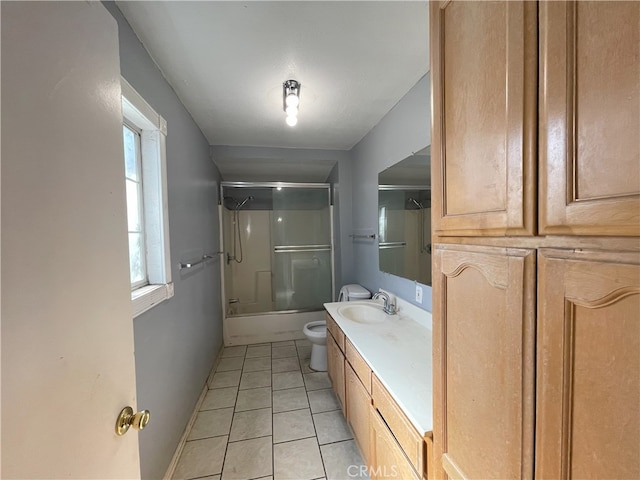 full bathroom with shower / bath combination with glass door, vanity, toilet, and tile patterned floors