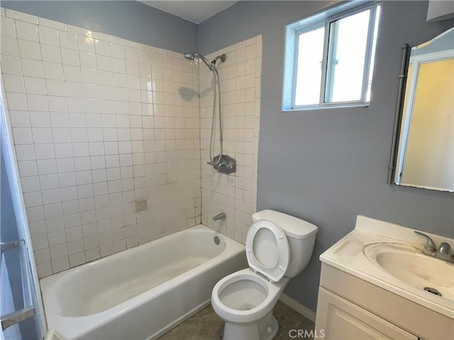 full bathroom with tile patterned floors, vanity, toilet, and tiled shower / bath