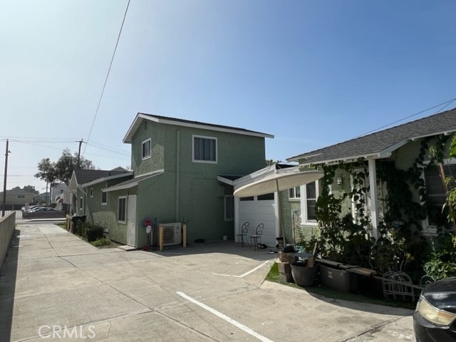 view of side of property with a garage