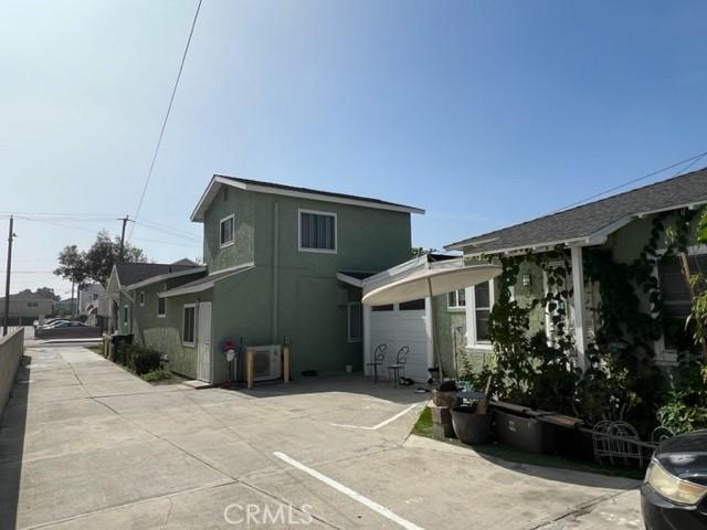 back of property featuring stucco siding and an attached garage