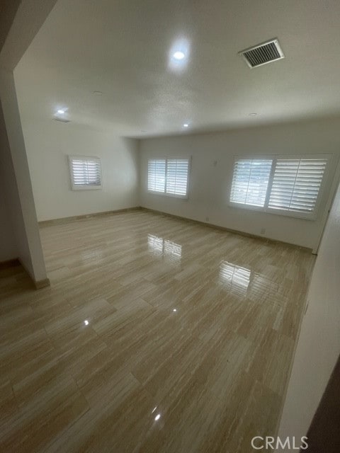 unfurnished room featuring light hardwood / wood-style floors