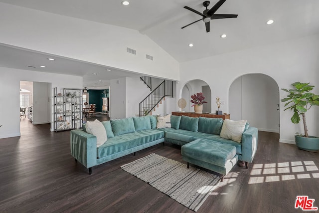 living room featuring high vaulted ceiling, ceiling fan, and dark hardwood / wood-style flooring