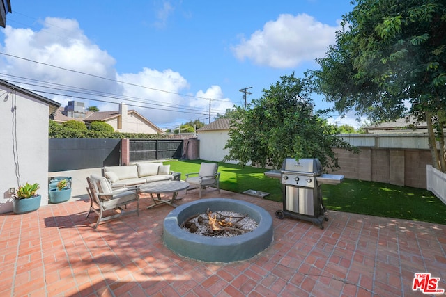 view of patio / terrace featuring an outdoor living space with a fire pit and a grill