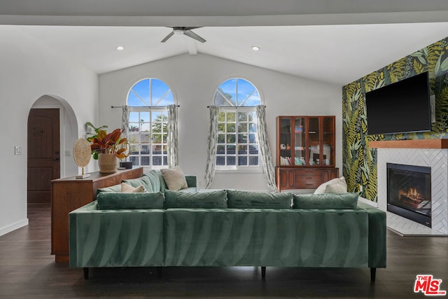 living room with lofted ceiling with beams, dark hardwood / wood-style flooring, and ceiling fan