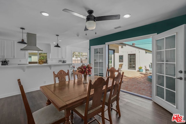 dining room with ceiling fan, hardwood / wood-style flooring, and french doors