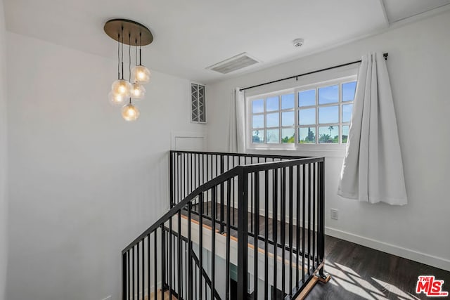 stairway with wood-type flooring