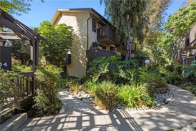 view of home's community with a pergola