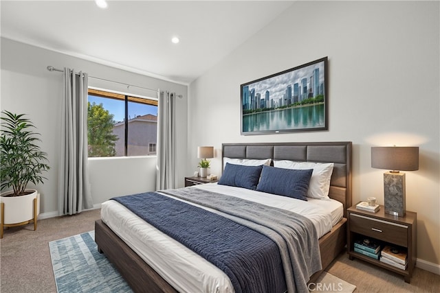 carpeted bedroom with lofted ceiling