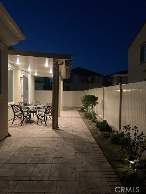 view of patio at twilight