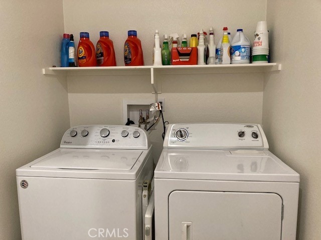 laundry room featuring separate washer and dryer