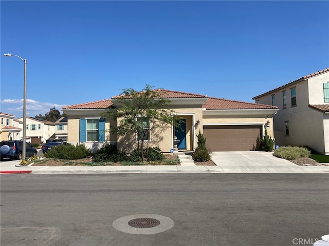 mediterranean / spanish-style home with a garage