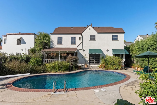 view of swimming pool with a patio area