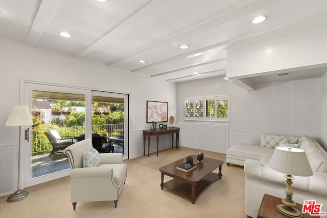 living room featuring light carpet and beam ceiling