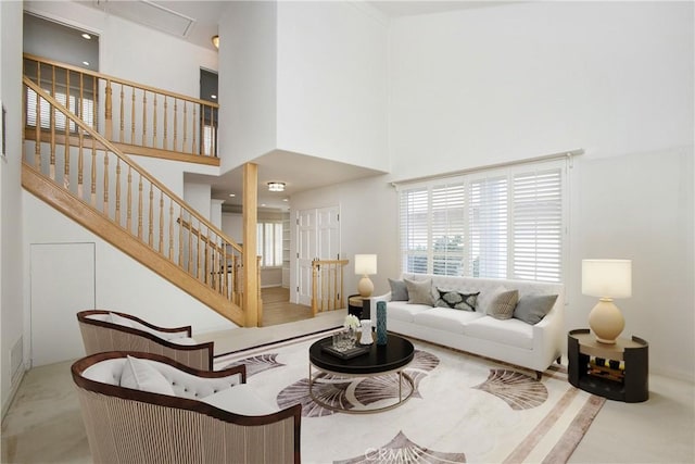 living room with a high ceiling