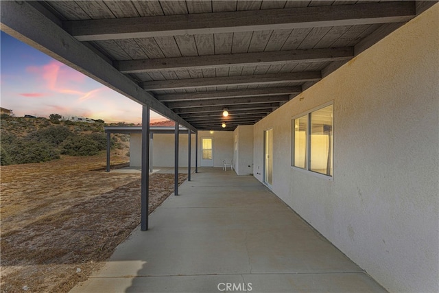 view of patio terrace at dusk