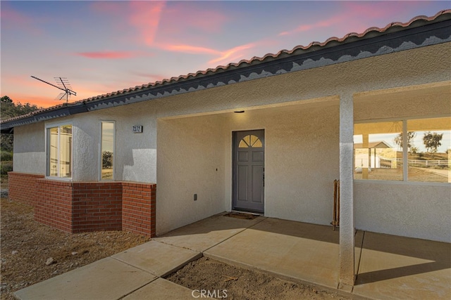 view of front of property with a patio