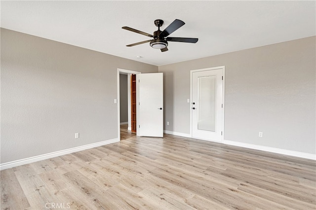 unfurnished room with ceiling fan and light hardwood / wood-style floors