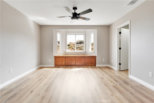 unfurnished living room with light hardwood / wood-style floors and ceiling fan