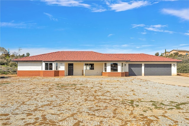 ranch-style home with a garage