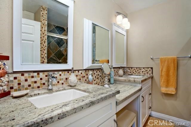 bathroom with vanity and backsplash