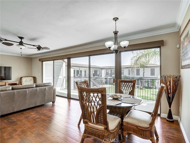 dining room featuring baseboards, ornamental molding, dark wood-style floors, and ceiling fan with notable chandelier