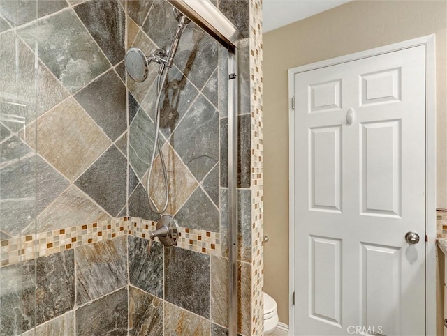 full bath with a shower stall and toilet