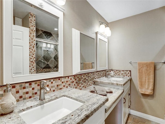 full bath featuring vanity, tile patterned flooring, a shower stall, and tasteful backsplash