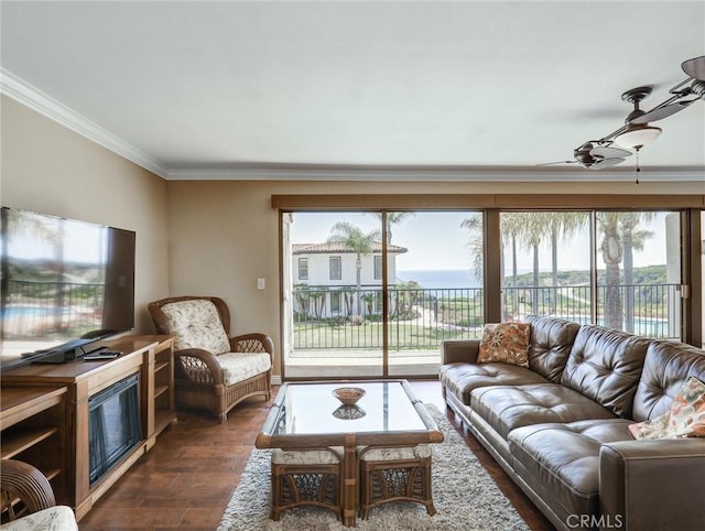 living room featuring plenty of natural light, crown molding, dark wood-style floors, and ceiling fan