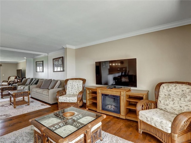 living room featuring hardwood / wood-style flooring and ornamental molding