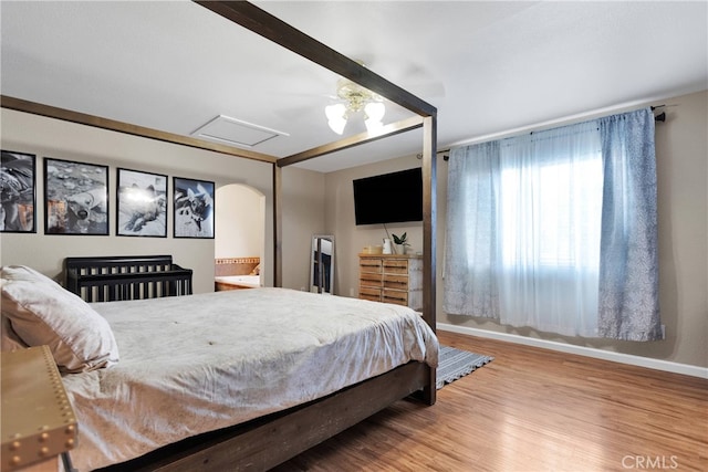 bedroom featuring wood-type flooring and ceiling fan