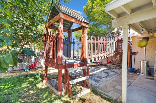 view of playground featuring a patio area