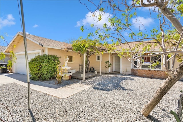 single story home featuring a garage