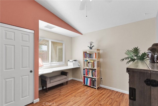 sitting room with light wood-type flooring, lofted ceiling, and ceiling fan