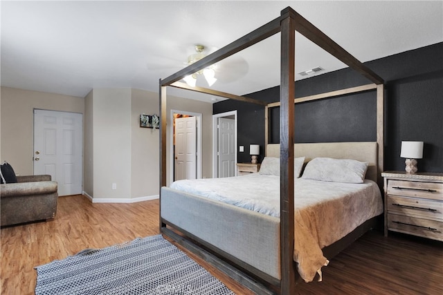 bedroom featuring ceiling fan and hardwood / wood-style flooring