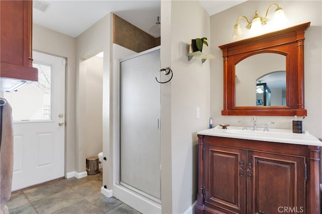 bathroom with vanity and an enclosed shower