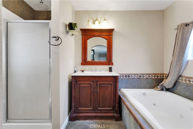 bathroom with plus walk in shower, tile patterned floors, and vanity