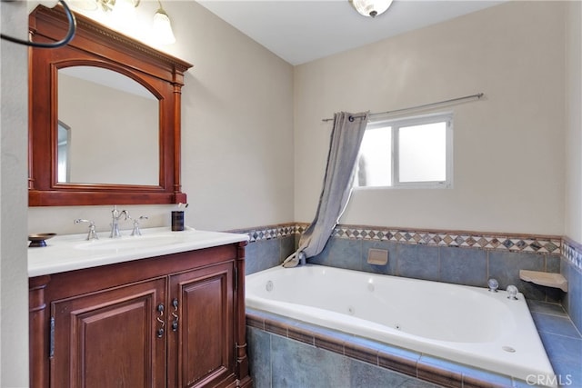 bathroom with vanity and tiled bath