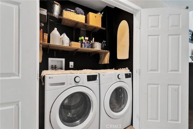 clothes washing area featuring washing machine and clothes dryer