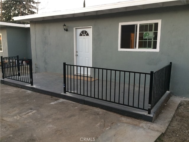 doorway to property with a patio area