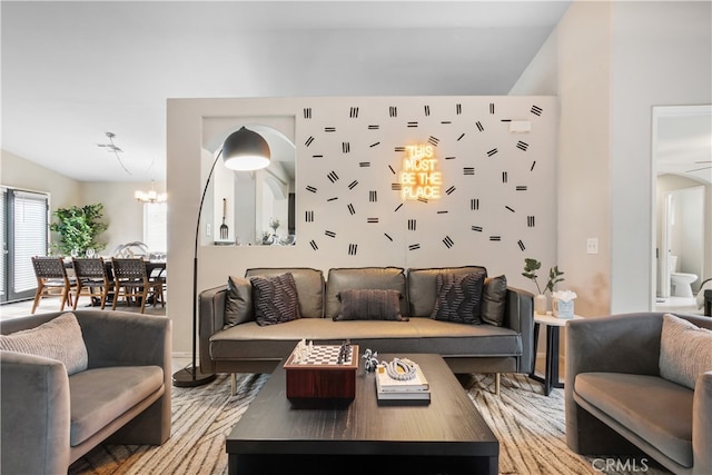 living room featuring hardwood / wood-style floors and a chandelier