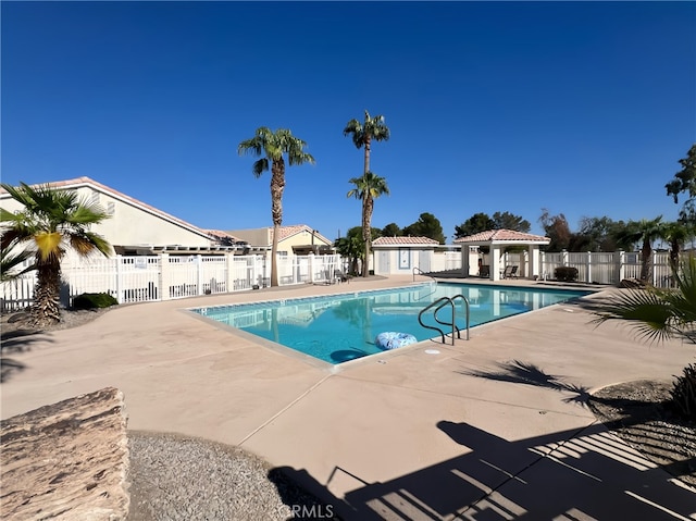 view of swimming pool featuring a patio