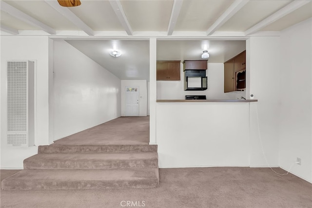 stairway featuring carpet and beam ceiling