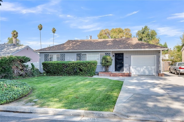 single story home featuring a garage and a front lawn