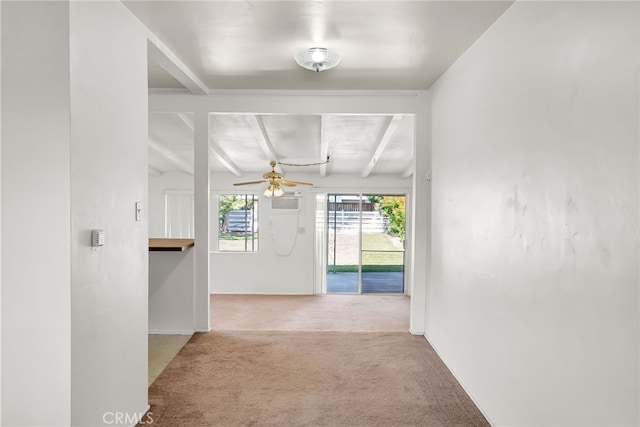 hall featuring beam ceiling and light carpet