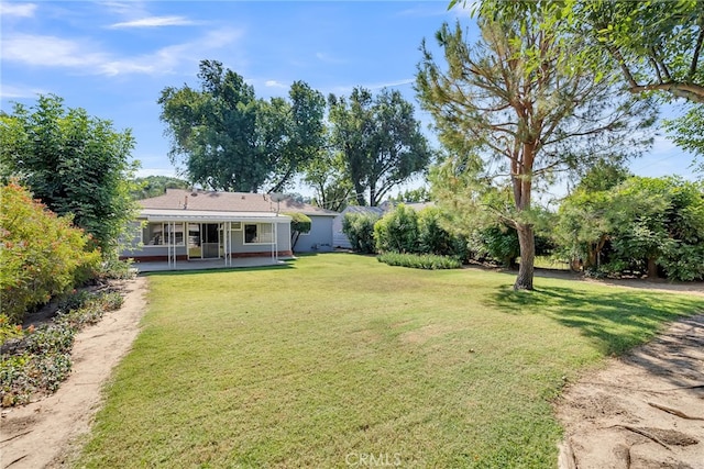 view of yard with covered porch