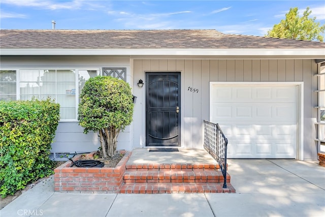 view of exterior entry featuring a garage