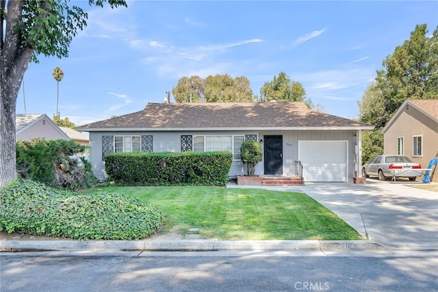 ranch-style home with a garage and a front lawn