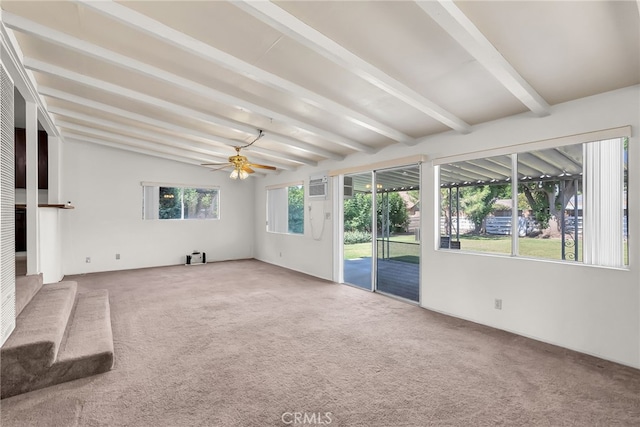 unfurnished sunroom featuring ceiling fan and beamed ceiling