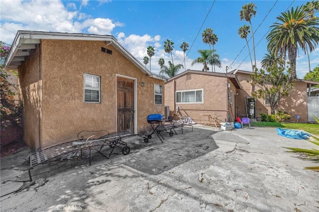 rear view of house with a patio